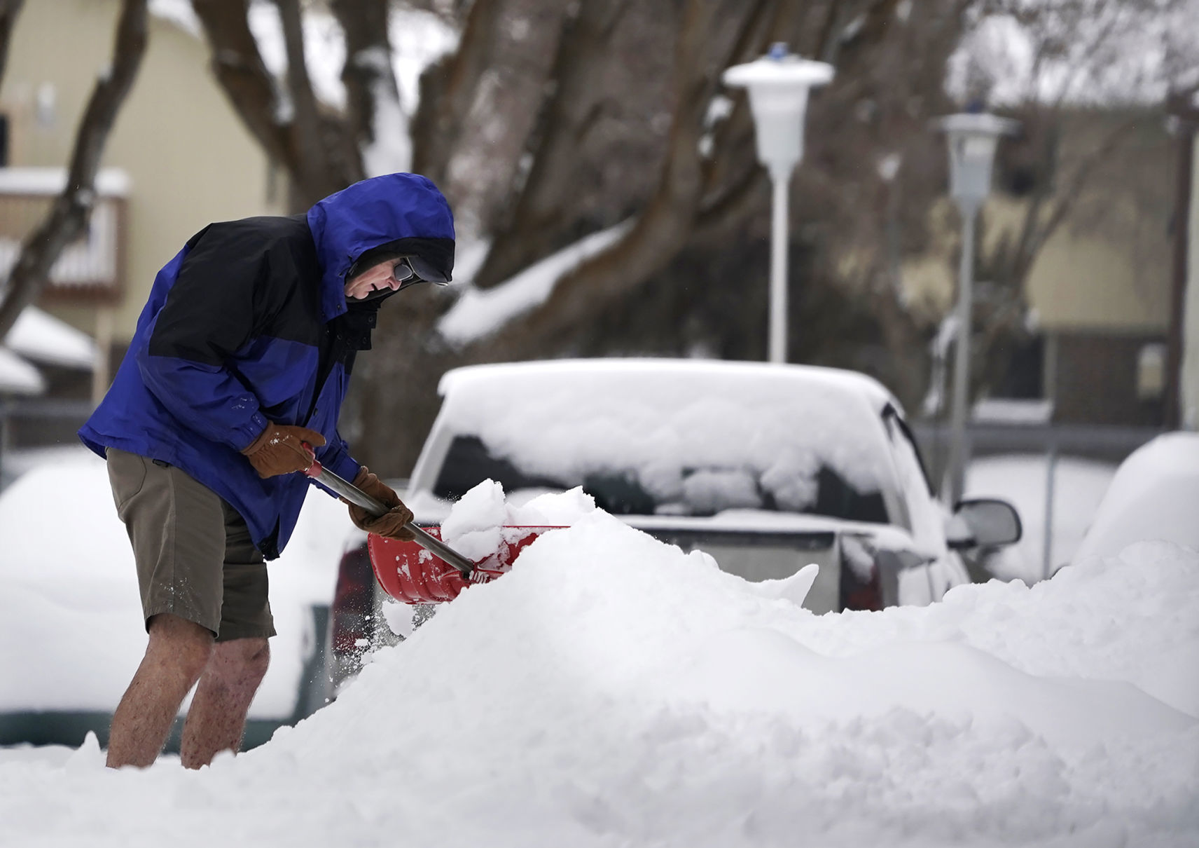 Shoveling snow in shorts